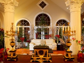 Looking from the foyer, the great room has been outfitted with a “forest” of balsam trees in planters, birch limbs and more.