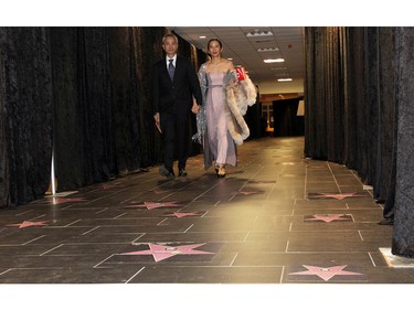 Ashbury College parents Dr. Derek So and Dr. Judy Shiau pass through the Hall of Fame, which served to recognize sponsors of this year's Ashbury Ball held at the Rockcliffe Park private school on Saturday, November 7, 2015.