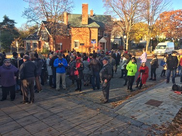 A small group of people gather outside Rideau Hall around 8 am before the gates officially open to the public for the swearing in ceremony for the 23rd prime minister of Canada, Justin Trudeau Wednesday, November 4, 2015.