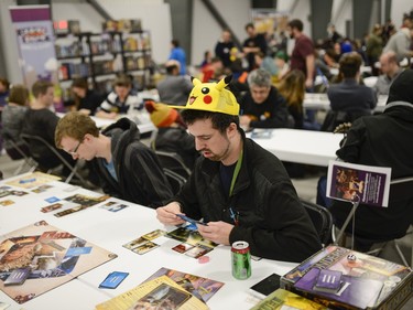 Attendees play card games at Pop Expo on Saturday, Nov. 21, 2015.