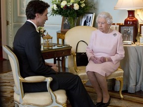 Prime Minister of Canada Justin Trudeau meets Queen Elizabeth II during a private audience at Buckingham Palace, London, Wednesday Nov. 25, 2015.