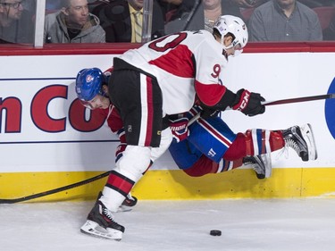 Montreal Canadiens' Brendan Gallagher is checked into the boards by Ottawa Senators' Alex Chiasson during first period NHL action.
