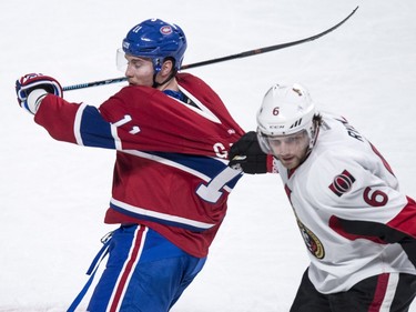 Ottawa Senators' Bobby Ryan tugs on Montreal Canadiens' Brendan Gallagher's jersey during first period NHL action.