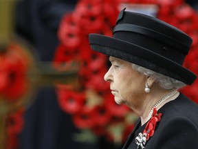 Britain's Queen Elizabeth II attends the Remembrance Sunday service at the Cenotaph in London, Sunday, Nov. 8, 2015. Remembrance Sunday is held each year to commemorate service men and women who fought in past military conflicts.