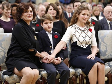 Justin Trudeau's wife Sophie Gregoire (R), son Xavier and mother Margaret (L) hold hands before he is sworn-in as Canada's 23rd prime minister during a ceremony at Rideau Hall in Ottawa November 4, 2015.