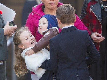 Ella-Grace Trudeau lifts her baby brother Hadrien as they wait for their father Prime Minister designate Justin Trudeau who is to be sworn in as the 23rd Prime Minister of Canada at Rideau Hall in Ottawa, Ontario, November 4, 2015.