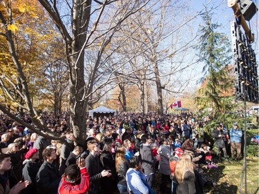 People gather to watch on big screens outside Rideau Hall as Canadian Prime Minister Justin Trudeau is sworn in as the 23rd Prime Minister in Ottawa, Ontario, November 4, 2015.