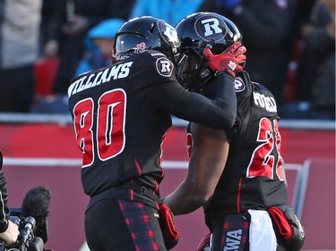 Chris Williams (L) of the Ottawa Redblacks celebrates  William Powell's touchdown against the Hamilton Tiger-Cats during first half of the East Conference finals at TD Place in Ottawa, November 22, 2015. (Jean Levac/ Ottawa Citizen)