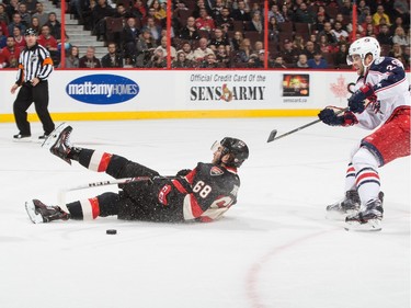 Mike Hoffman #68 of the Ottawa Senators is taken down on a breakaway by Cody Goloubef #29 of the Columbus Blue Jackets resulting in a penalty shot (unsuccessful).