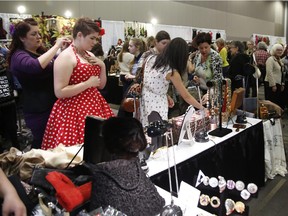 Customers browse items for sale at the Ottawa Vintage Clothing Show at the Shaw Centre on Sunday, November 8, 2015.