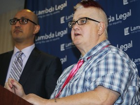 Dana Zzyym, right, the plaintiff in a federal discrimination lawsuit filed by Lambda Legal against the U.S. State Department seeking more gender options for passports, responds to a question while Paul D. Castillo, staff attorney in the South Central Regional Office of Lambda Legal in Dallas, looks on during a news conference about the case Monday, Oct. 26, 2015, in Denver. Zzyym, an intersex person, was denied a U.S. passport for refusing to check either male or female on the application form.