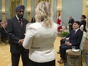 Harjit Sajjan is sworn in as defence minister at Rideau Hall in Ottawa on Wednesday, November 4, 2015. Prime Minister Justin Trudeau is at right.