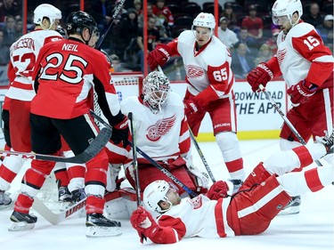 Detroit's Darren Helm gets upended in front of his own net, which led to a small skirmish during first period action between the Ottawa Senators and Detroit  Red Wings Monday (Nov 16, 2015) at Canadian Tire Centre.