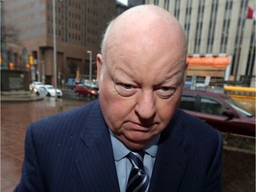 Senator Mike Duffy leaves the Elgin Street Courthouse following the first day of final arguments.