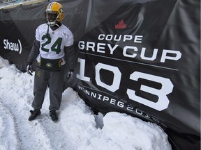 Edmonton Eskimos' Akeem Shavers poses with the Grey Cup sign during a team practice session in Winnipeg.