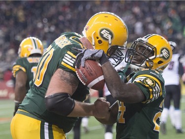 Edmonton Eskimos' Akeem Shavers, right, celebrates his touchdown with teammate Justin Sorensen during the 103rd Grey Cup in Winnipeg, Man., Sunday, Nov. 29, 2015.