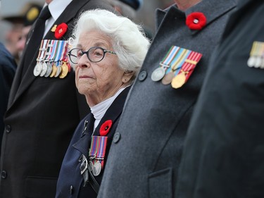 Elsa Lessard, veteran of the Women's Royal Canadian Naval Service, stands with her fellow veterans as the National Remembrance Day Ceremony takes place at the National War Memorial in Ottawa.