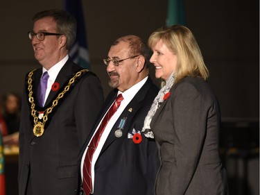 Ernest G. Tannis receives the Order of Ottawa from Mayor Jim Watson and Councillor Diane Deans at City Hall in Ottawa on Tuesday, November 10, 2015.