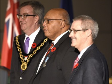 Ewart Walters receives the Order of Ottawa from Mayor Jim Watson and Councillor Keith Egli at City Hall in Ottawa on Tuesday, November 10, 2015.