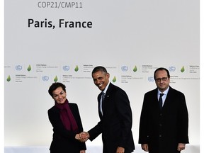 UN climate chief Christiana Figueres shakes hands with US President Barack Obama as  French President Francois Hollande (R) stands by upon his arrival for the opening of the UN conference on climate change, on November 30, 2015 at Le Bourget, on the outskirts of the French capital Paris. More than 150 world leaders are meeting under heightened security,  for the 21st Session of the Conference of the Parties to the United Nations Framework Convention on Climate Change (COP21/CMP11), also known as Paris 2015 from November 30 to December 11.