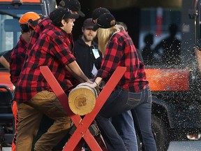 Traditional log cutting ceremony after a RedBlacks' touchdown.