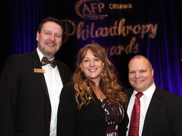 From left, AFP Ottawa Chapter board president Derek deLouche with Paula Street, chair of the organizing commitee, and past chair Claude Drouin, at the 21st Annual AFP Ottawa Philanthropy Awards dinner held at the Shaw Centre on Thursday, November 19, 2015.