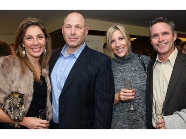 From left, Christine Steenbakkers and John Steenbakkers with Jodi Downs and Andy Downs, guests of Kott Lumber, at An Unlikely Pairing: Adventures in Food Trucks and Fine Wines, held in support of Christie Lake Kids on Thursday, November 12, 2015, at Ashbury College in Rockcliffe Park. (Caroline Phillips / Ottawa Citizen)