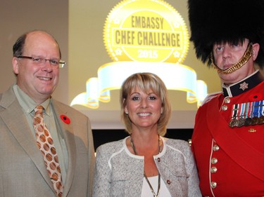 From left, Dr. David Mack, chief of gastroenterology at the Children's Hospital of Eastern Ontario and director of the CHEO Inflammatory Bowel Disease Centre, with Michele Hepburn, president of the IBD Foundation, and Sgt. Patrick Alden with the Governor General's Foot Guards at the Embassy Chef Challenge and fundraiser for IBD care at CHEO, held Thursday, November 5, 2015, at the John G. Diefenbaker Building on Sussex Drive.