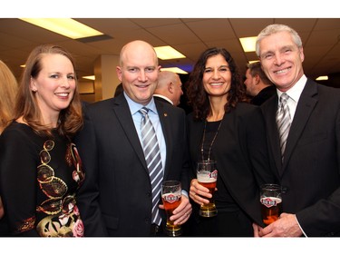 From left, Heather Strachan and her husband, Brent Strachan, senior vice president, Minto Communities, with his colleague, Susan Murphy, vice president of development with Minto Communities, and her husband, Noel Murphy, at An Unlikely Pairing: Adventures in Food Trucks and Fine Wines, held in support of Christie Lake Kids on Thursday, November 12, 2015, at Ashbury College in Rockcliffe Park. (Caroline Phillips / Ottawa Citizen)