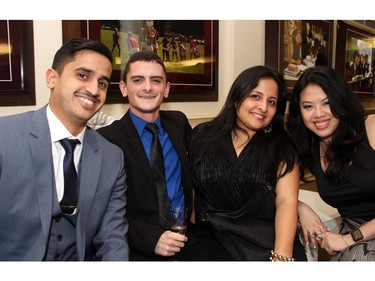 From left, Irfan Ahmed, Zane Dickie, Ameera Girgis and Jezsica Sim, all with Excel HR staffing firm, at An Unlikely Pairing: Adventures in Food Trucks and Fine Wines, held in support of Christie Lake Kids on Thursday, November 12, 2015, at Ashbury College in Rockcliffe Park. (Caroline Phillips / Ottawa Citizen)