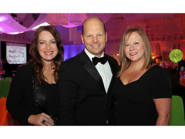 From left, Janice McDonald, president of The Beacon Agency, with her husband, Stephen Bleeker, owner of Assurance in-home care, and Jackie King, senior vice president and general manager with Hill + Knowlton Canada, at the annual Ashbury Ball held at the Rockcliffe Park private school on Saturday, November 7, 2015.
