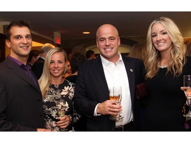 From left, Joey Theberge and Jenn Theberge with Mike Lalande, president of Lalande Insurance, and Brooke Ritchie at An Unlikely Pairing: Adventures in Food Trucks and Fine Wines, held in support of Christie Lake Kids on Thursday, November 12, 2015, at Ashbury College in Rockcliffe Park. (Caroline Phillips / Ottawa Citizen)