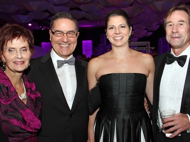 From left, Leslie Santini with her husband, Pat Santini, a partner with Kelly Santini LLP, and Lisa Langevin, also a partner with the firm, and lawyer Chris Moore at The Ottawa Hospital Gala, held at The Westin Ottawa on Saturday, November 21, 2015. (Caroline Phillips / Ottawa Citizen)