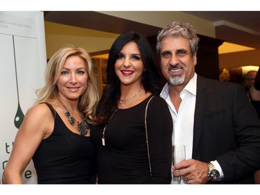 From left, Maria Bassi with Laila Saikaley and her husband, Eli Saikaley, co-owner of Silver Scissors hair salon in the Glebe, at An Unlikely Pairing: Adventures in Food Trucks and Fine Wines, held in support of Christie Lake Kids on Thursday, November 12, 2015, at Ashbury College in Rockcliffe Park. (Caroline Phillips / Ottawa Citizen)