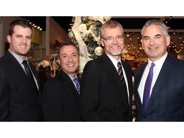 From left, PhD student Dan McEwen, Bruyère clinical manager Mario DaPonte, Dr. Frank Knoefel and Bernie Forestall, a vice president with the Bruyère Foundation, helped out at the Fashion FUNraiser benefit held at Shepherd's store on Monday, November 23, 2015, in support of Bruyère.