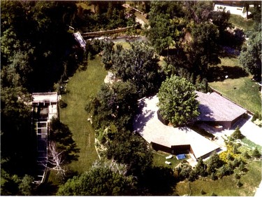 Original owner Mark Bormann describes the home as looking from above like ‘a deck of cards thrown loosely around the tree.’ The hill the home is built on gives way to a ‘meadow' in the backyard, beyond which is Graham Creek. The creek bisects the property, which continues back up the ravine on the left, hence the connecting bridges.