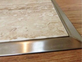 This stainless-steel transition strip from Schluter Systems makes a durable connection between ceramic tile and a laminate floor.