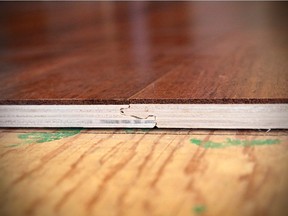 This cross section of engineered flooring shows the layer of real wood on top. This allows for a couple of sanding and refinishing sessions, extending the life of the floor.