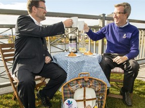 Gatineau Mayor Maxime Pedneaud-Jobin and Ottawa Mayor Jim Watson mugging it up for the cameras to promote the picnic on the Alexandra Bridge, held July 2, 2017.