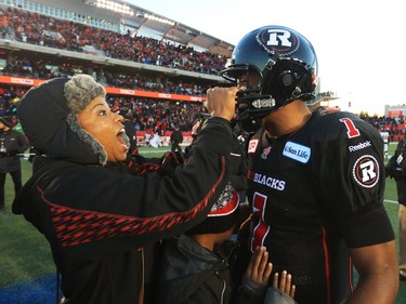 Henry Burris of the Ottawa Redblacks celebrates with his wife and family after his team's win against the Hamilton Tiger-Cats in the East Conference finals at TD Place in Ottawa, November 22, 2015.