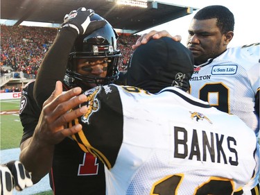 Henry Burris of the Ottawa Redblacks is congratulated by Brandon Banks of the Hamilton Tiger-Cats in the East Conference finals at TD Place in Ottawa, November 22, 2015.