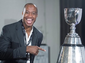 Ottawa Redblacks quarterback Henry Burris looks at the Grey Cup during the team breakfast before the up coming CFL 103rd CFL Grey Cup game against the Edmonton Eskimos in Winnipeg, Man., on Thursday, November 26, 2015.