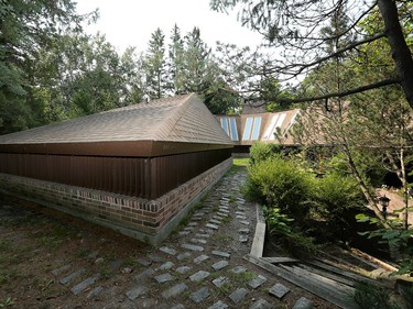 The brick and cedar found on the exterior is carried inside for a look that connects with the natural surroundings.