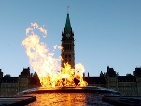 The Centre Block of the Parliament Buildings is shown through the Centennial Flame on Parliament Hill in Ottawa.