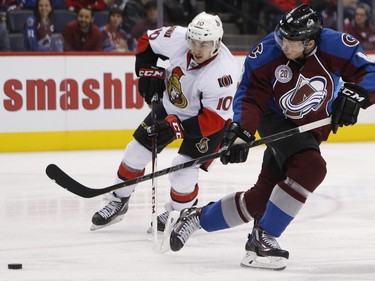 Colorado Avalanche right wing Jack Skille, front, loses control of the puck as Ottawa Senators center Shane Prince defends during the first period of an NHL hockey game Wednesday, Nov. 25, 2015, in Denver.