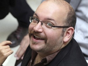 FILE - In this photo April 11, 2013 file photo, Jason Rezaian, an Iranian-American correspondent for the Washington Post, smiles as he attends a presidential campaign of President Hassan Rouhani in Tehran, Iran. Iran had Rezaian to an unspecified prison term following his conviction on charges that include espionage.