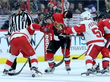 Jean Gabriel Pageau fights for the puck after the face-off during first period action between the Ottawa Senators and Detroit  Red Wings Monday (Nov 16, 2015) at Canadian Tire Centre.