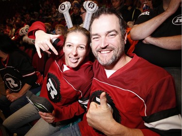 Jennifer Coles and Emile Beaudry show their Ottawa Redblacks love at the TD Place arena as thousands of fans gather to watch the 2015 CFL Grey Cup Sunday May 29, 2015.