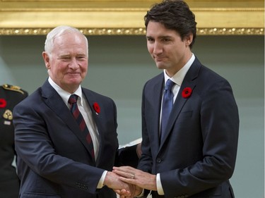 Prime Minister Justin Trudeau shakes hands with Governor General David Johnston after being sworn in as prime minister of Canada at Rideau Hall in Ottawa on Wednesday, Nov. 4, 2015.