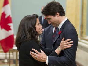 Prime Minister Justin Trudeau speaks with Minister of Justice Jody Wilson-Raybould during a swearing-in ceremony at Rideau Hall, Wednesday Nov.4, 2015 in Ottawa.